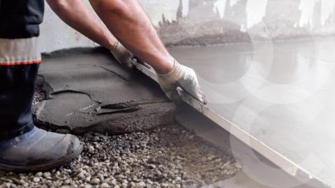 Hands laying concrete