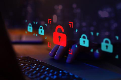 Digital locks hovering over hands on a keyboard
